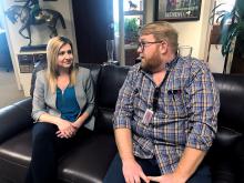 Jen Perkins sits with Zach Taylor on a couch