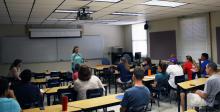 Judy Horton addresses a class at UA