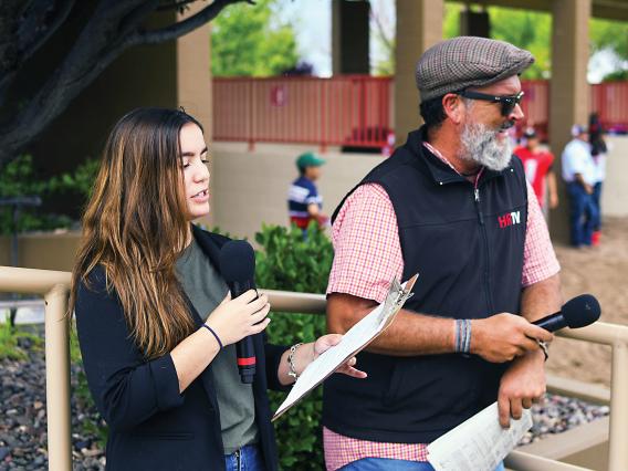 Giselle Lugo and RTIP alum Aaron Vercruysse handicapping  in the paddock at Arizona Downs
