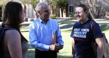 Andrew Turro speaks with students on campus